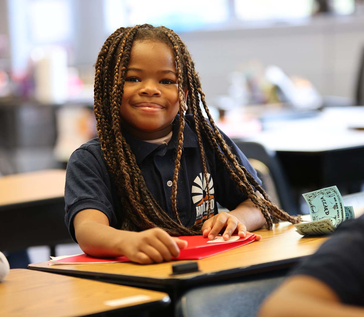 Smiling children together outdoors.